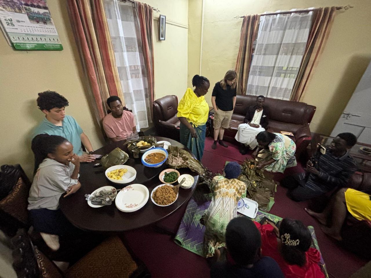 Host family sharing a meal with intern
